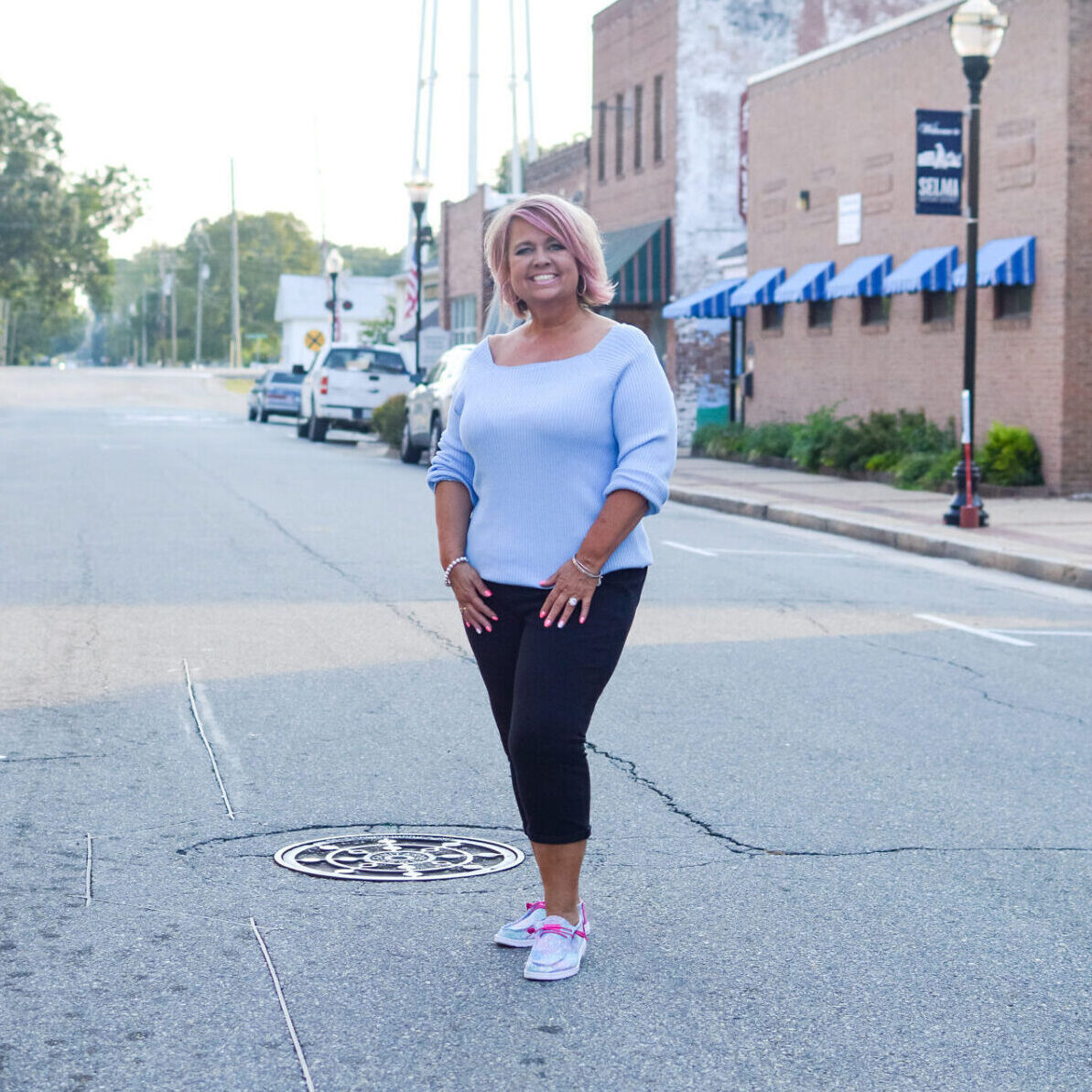 Shannon Sellers standing on a small-town street